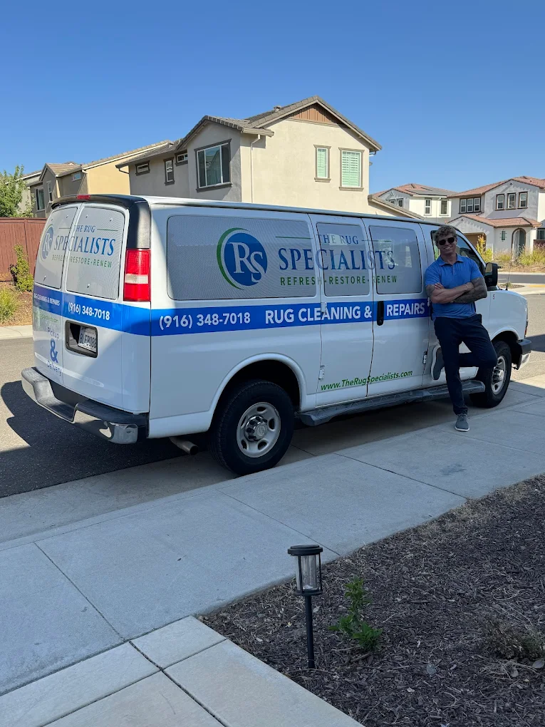 The Rug Specialists owner with the branded pickup & delivery van